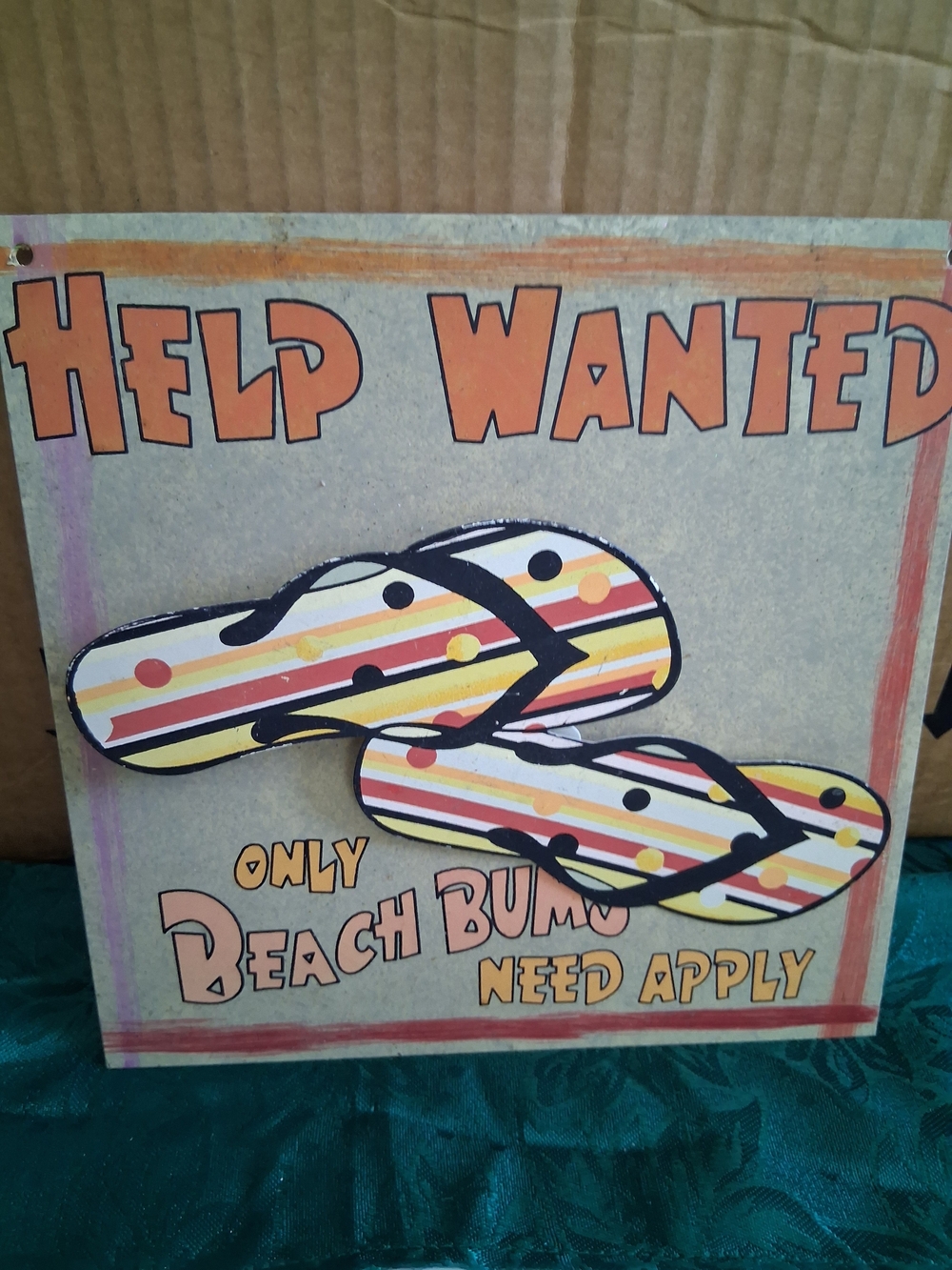 2 Beach Signs with Striped And Flowered Flip-Flops.